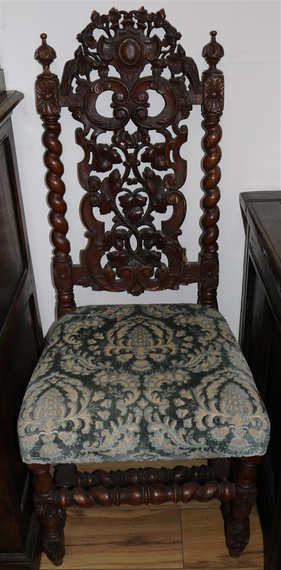 A pair of late Victorian Carolean style walnut hall chairs